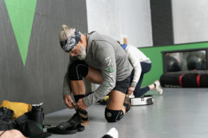 Invictus Masters Athlete, Kevin Koester, ties his shoes before a workout.