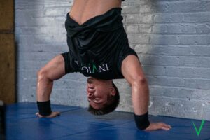 Invictus athlete doing handstand push-ups in the CrossFit Open 23.3 workout.
