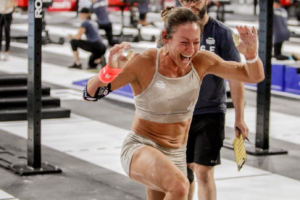 Invictus Masters Athlete, Jenn Ryan, crosses the finish line in exoneration at the 2022 CrossFit Games.